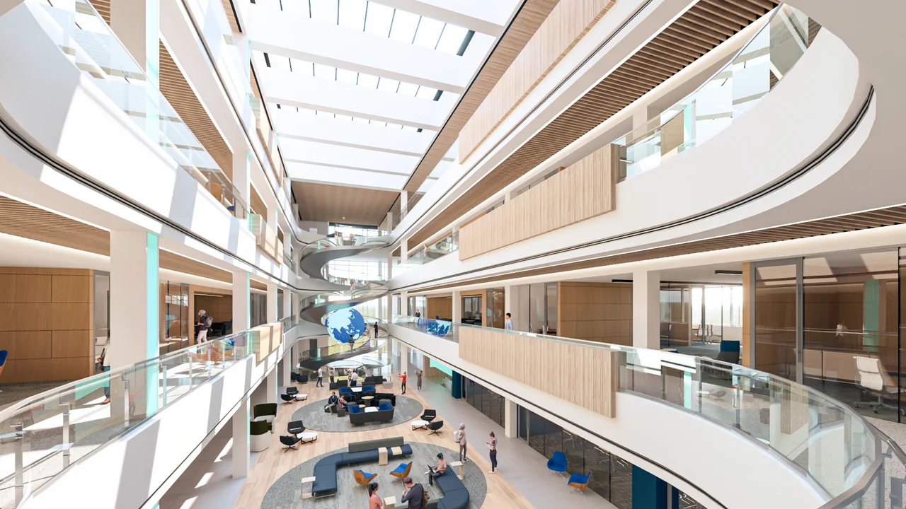 Concept view through the multilevel atrium with informal seating and a central stair.